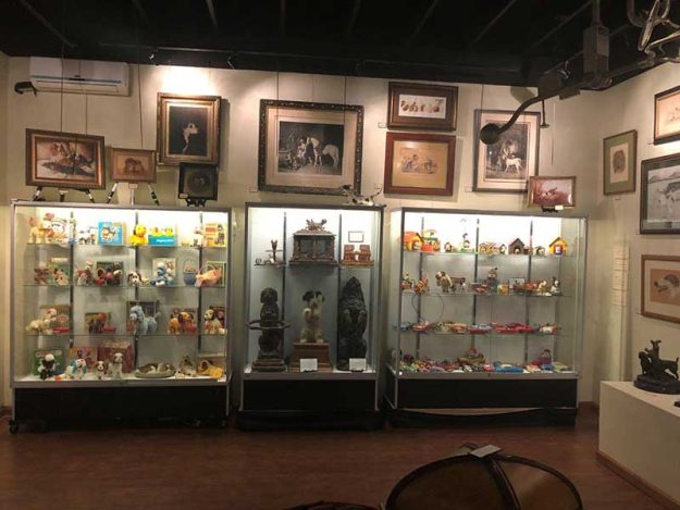 dogs-in-art-collectibles rare toys on display at DFW Elite Toy Museum